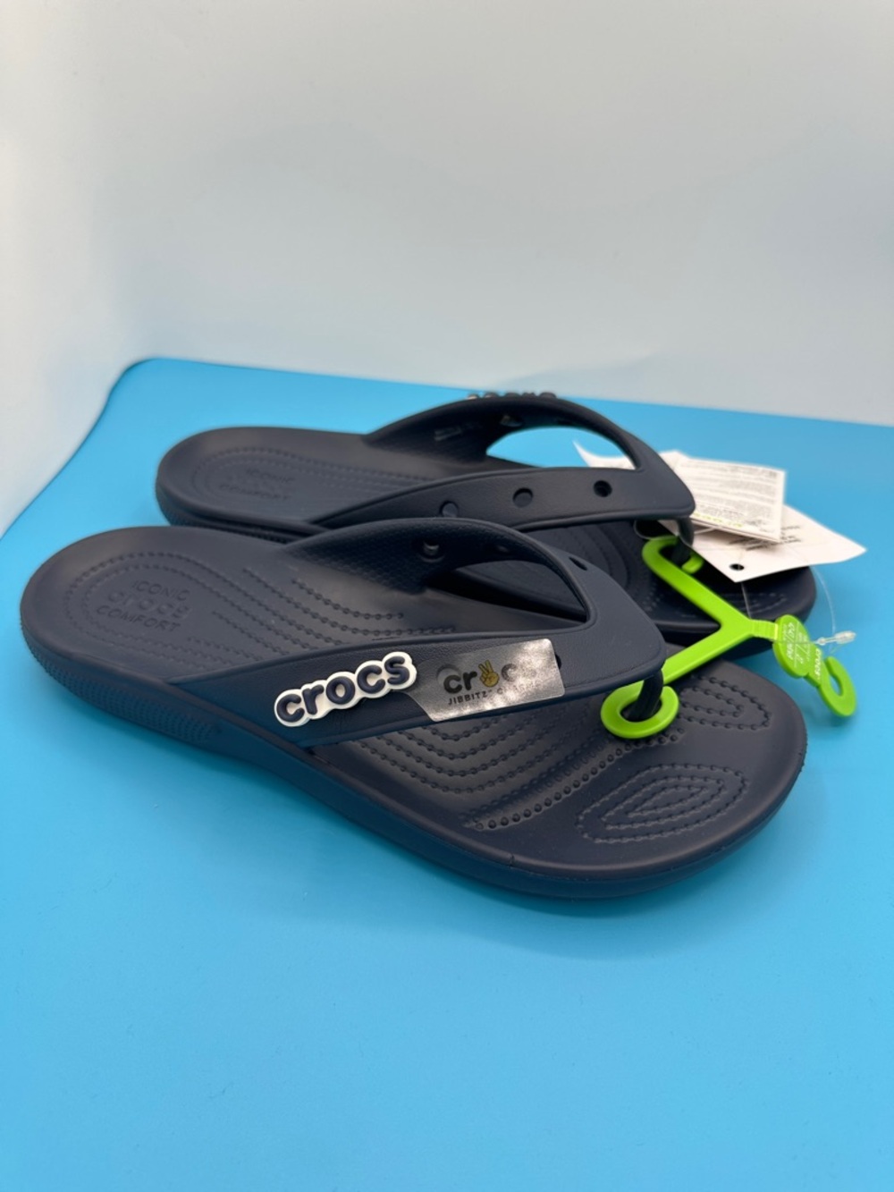 CROCS Navy Blue with Jibbit charm. Flip Flop Womens Size 11 Brand New